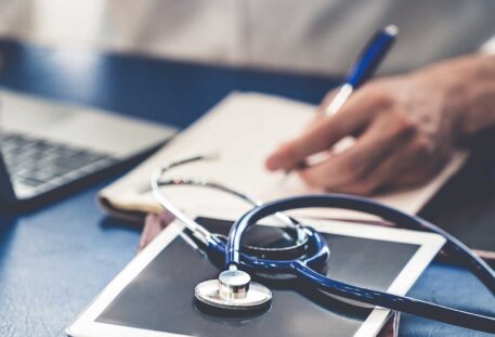 Doctor working in hospital office. Medical healthcare concept